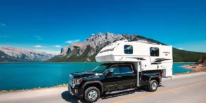 Truck camper near river and mountains - Truck camping by the camper world