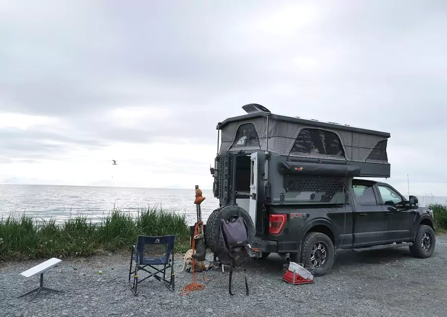 camping in a truck camper on a beach side 