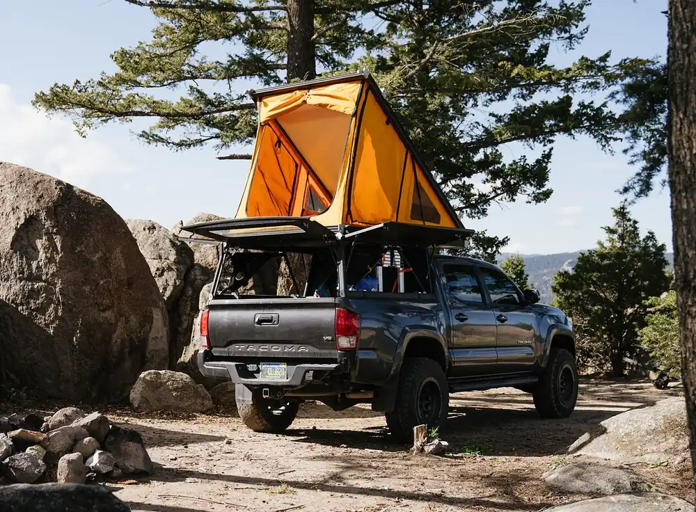 The 7 Best Wedge Campers & Canopy Campers for 2026 (Real Prices, Real Weights) 2 Go Fast Campers Platform Camper with tent deployed