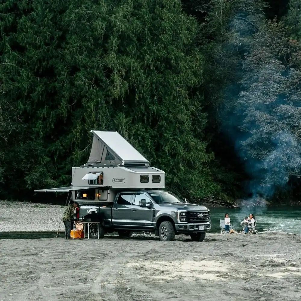 The 7 Best Wedge Campers & Canopy Campers for 2026 (Real Prices, Real Weights) 7 Scout pop-top truck camper with roof raised at camp