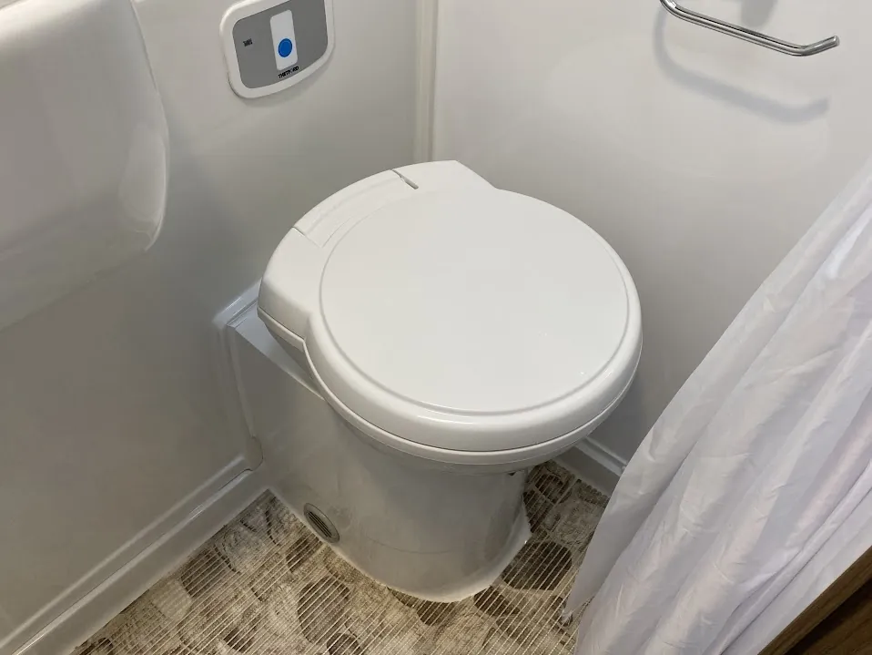 Cassette Toilets for Truck Camper Boondocking: The Complete Honest Guide 4 Thetford cassette toilet in a truck camper wet bath with level indicator panel