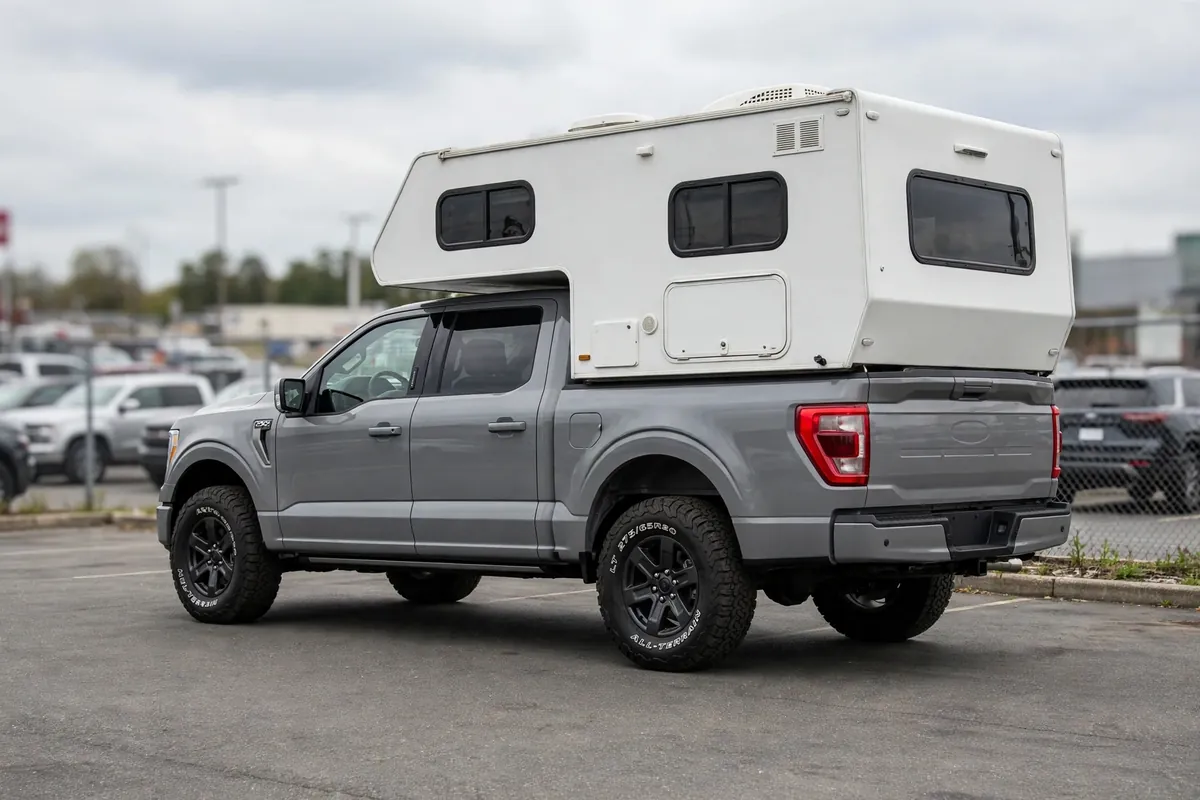 F150 Truck Camper Guide: Real Payload Math for Your F-150 3 Side profile of a crew cab pickup with HD payload stance carrying a truck camper, level on LT tires