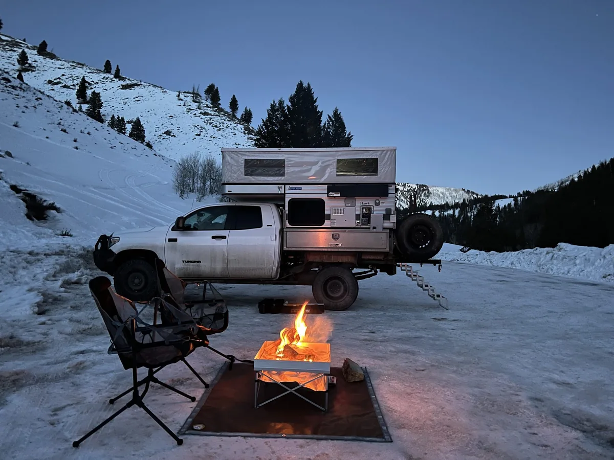 How to Winterize a Truck Camper (2026 Step-by-Step Guide) 1 Truck camper winter camping in deep snow at dusk