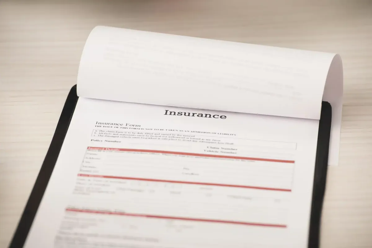 Insurance claim form on a clipboard, part of documenting a camper for a claim