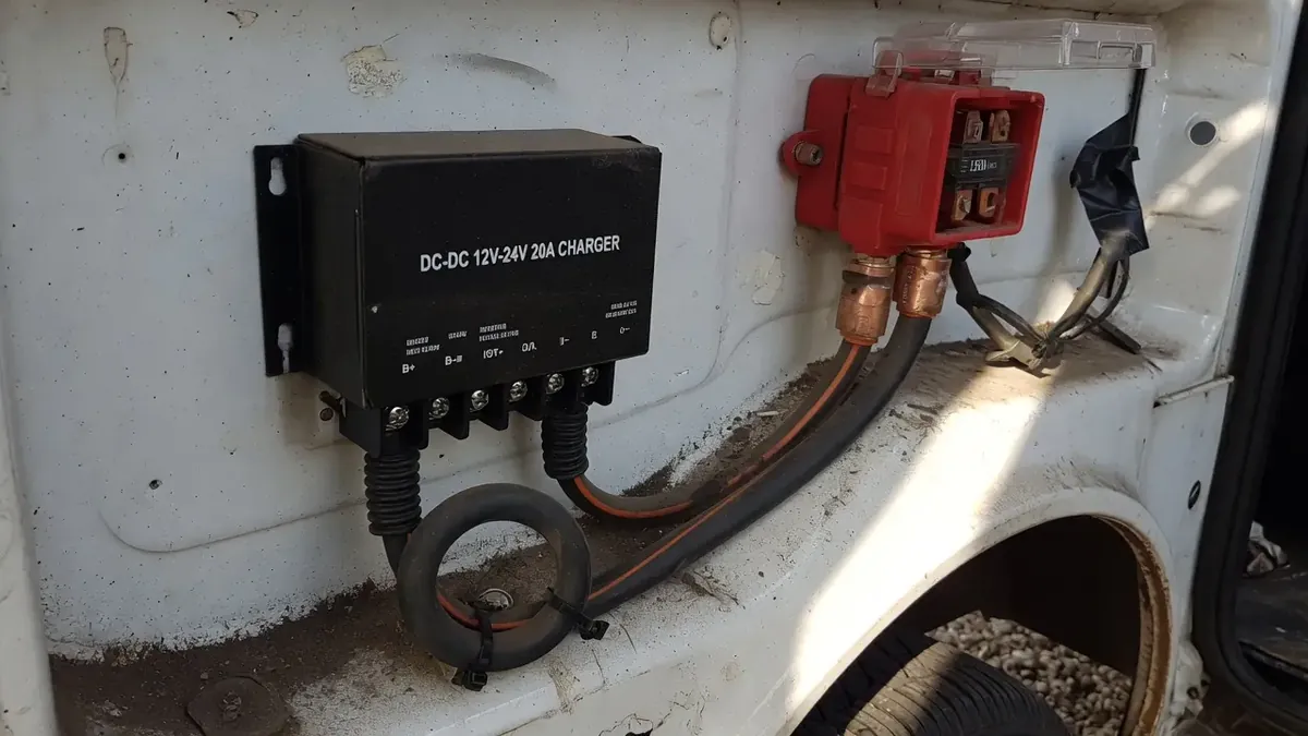 Truck Camper Solar Panels & Lithium Sizing Guide — How Big a System Do You Actually Need? 6 DC-DC battery charger installed in a vehicle with heavy-gauge cabling