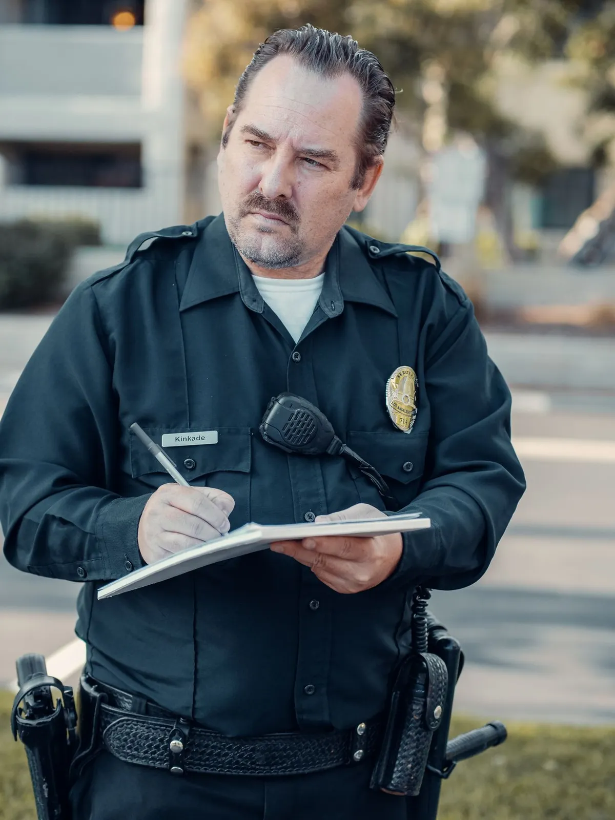 Truck Camper Theft Prevention: A Security Guide That Actually Works 7 A police officer writing a theft report in a notepad