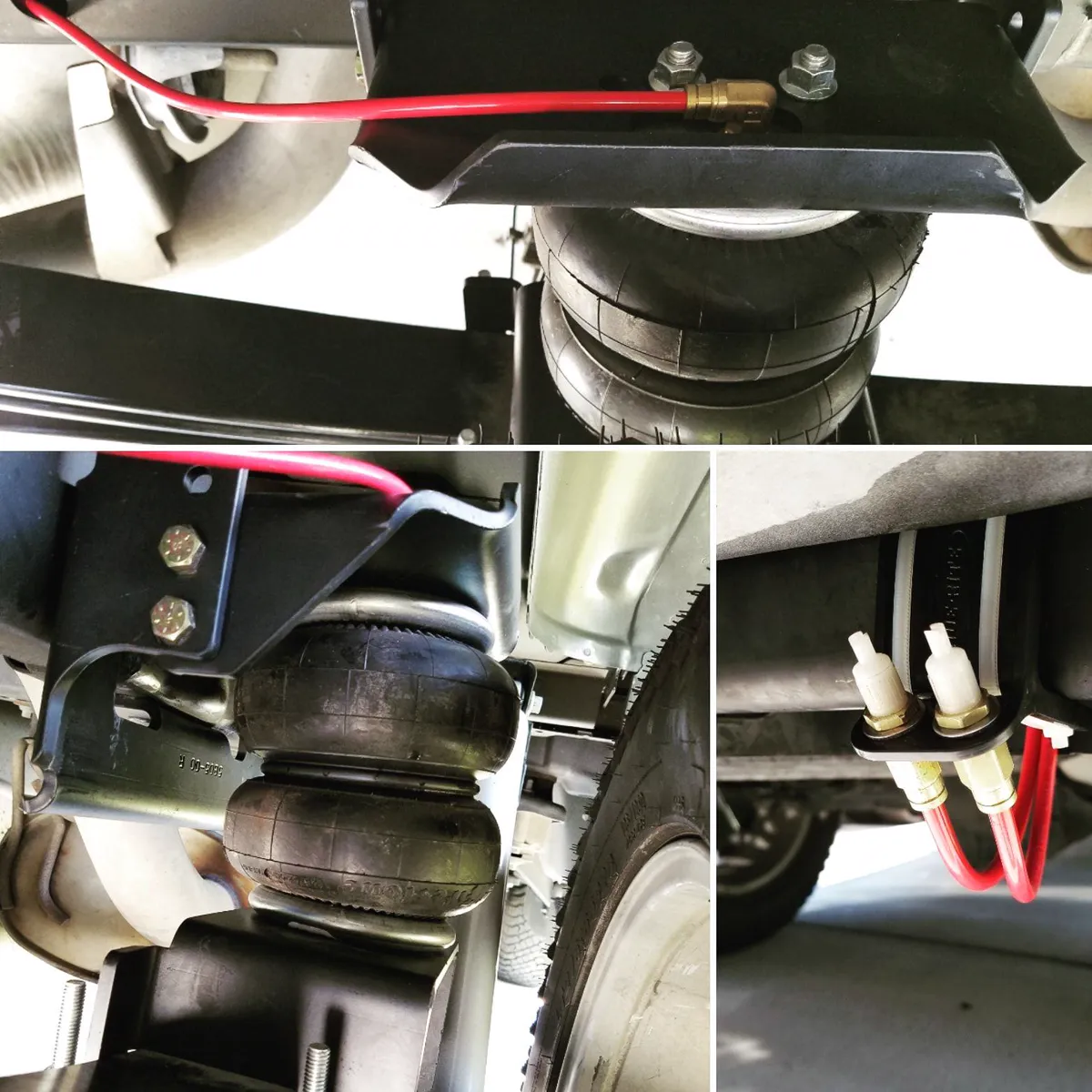 Air-bag helper springs installed on a pickup truck's rear suspension with fill valves.