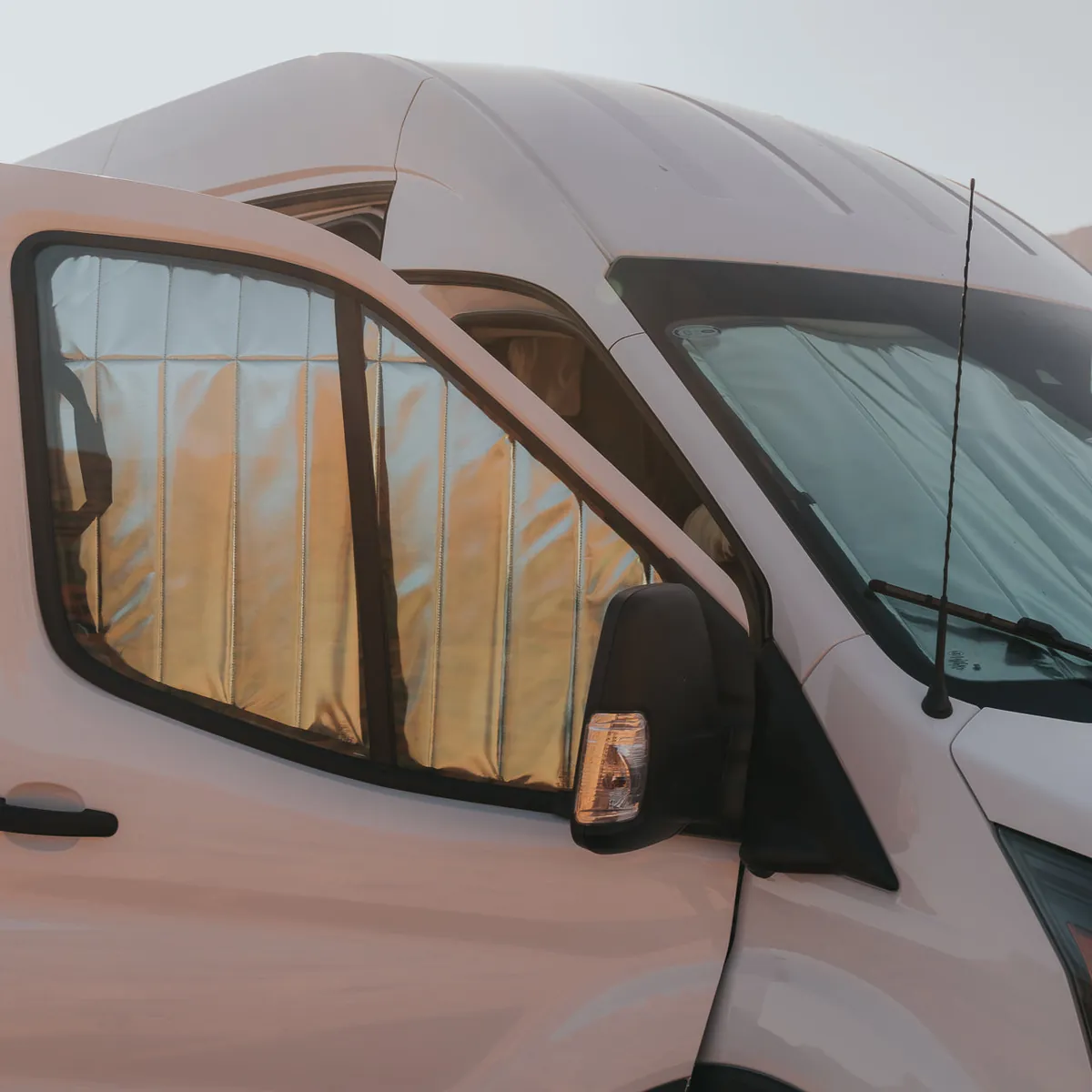 How to Stop Condensation in a Truck Camper (2026 Definitive Guide) 5 Reflective window insulation covers in a camper